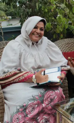 Farida Bharmal holding a diary and pen